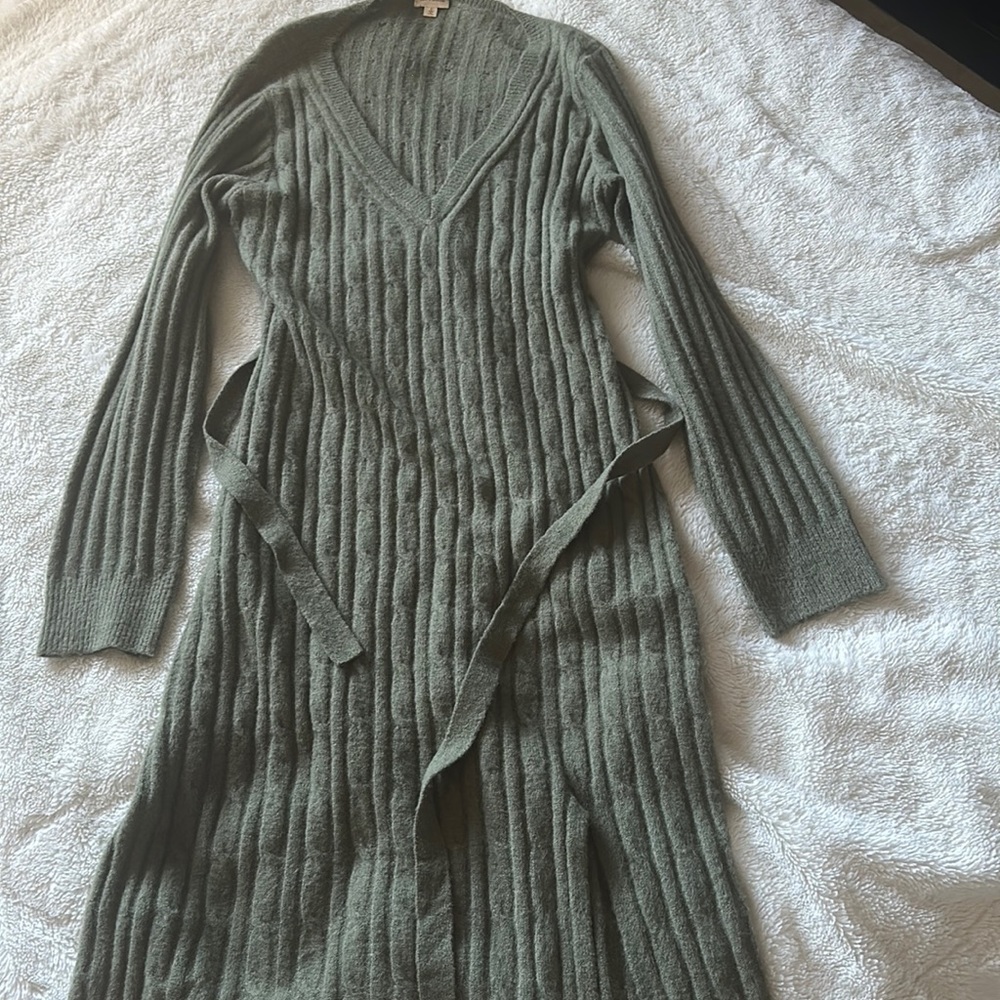 Army green below the knee dress with a front slit.